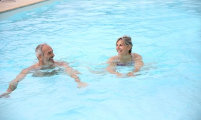 Man and Woman Enjoying a swim in the Pool