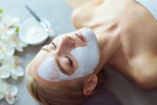 a woman enjoys spa therapies