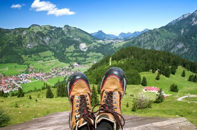 Ustic over valley and mountains, hiking shoes