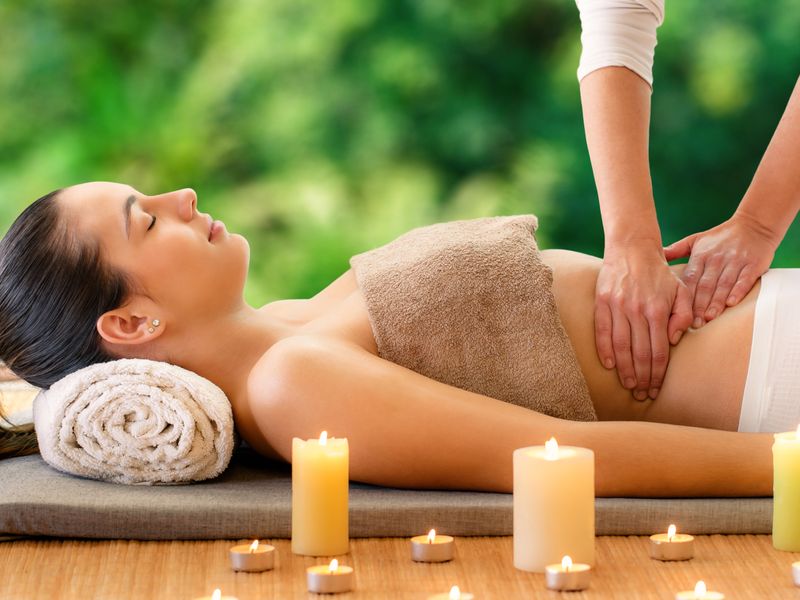 Lady receiving healing therapeutic massage