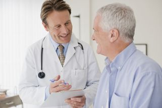 Doctor gives good medical advice to a man who is about to start a radon therapy programme due to worstening arthritis pains